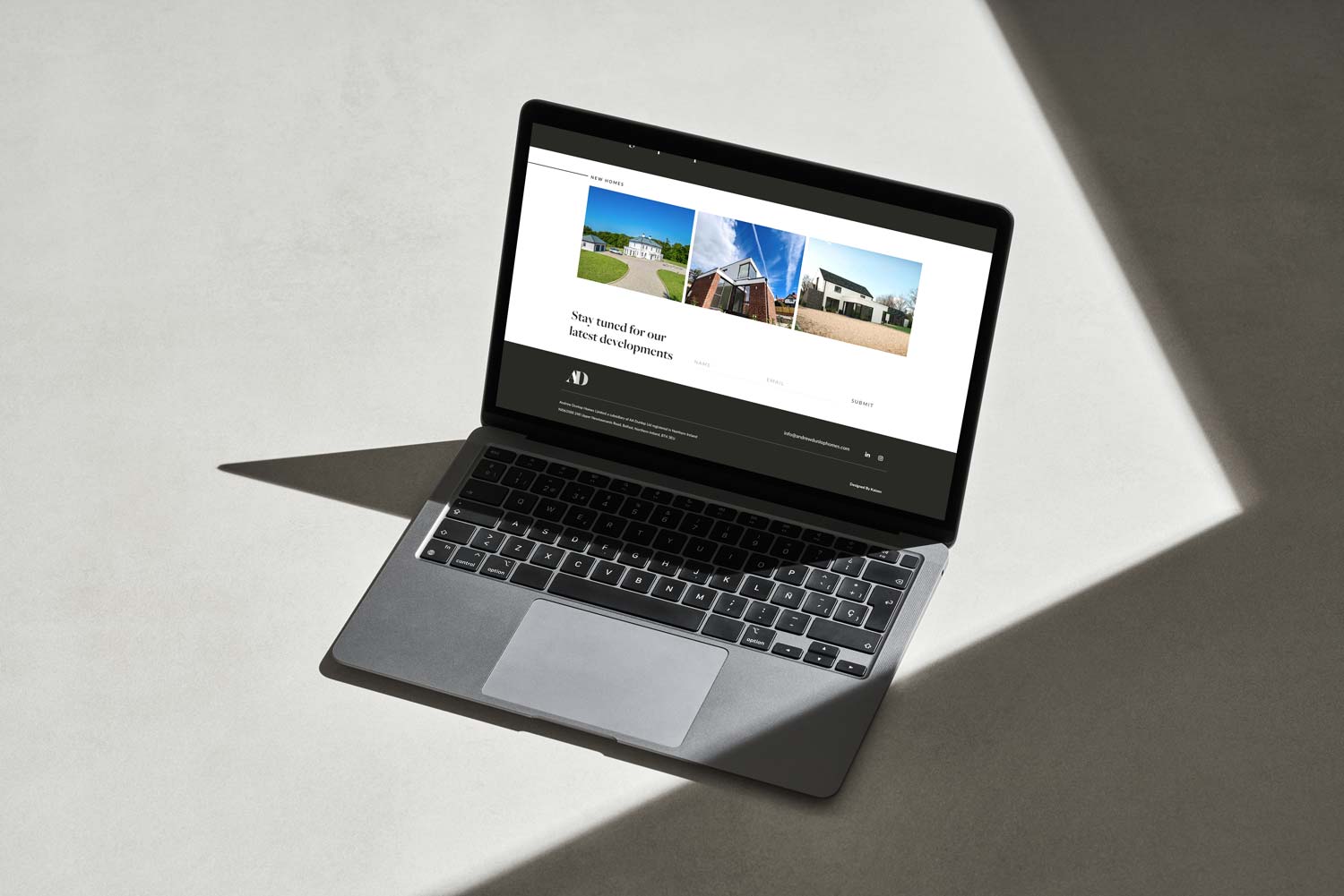 We Are Kaizen Andrew Dunlop Homes Homes website on a laptop