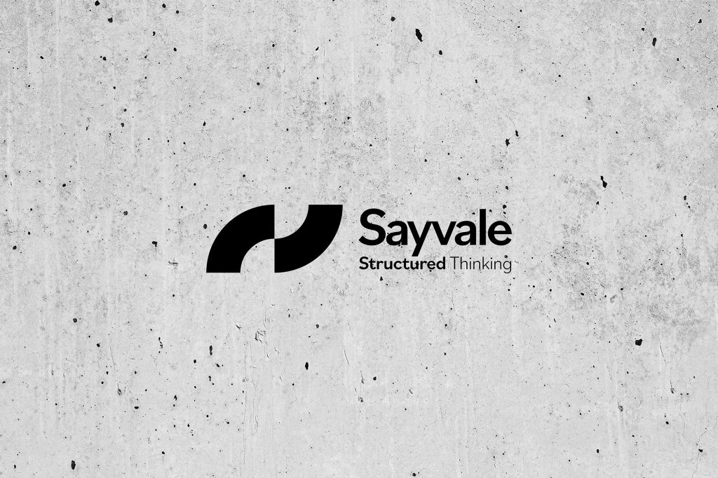We Are Kaizen Sayvale logo on a concrete background